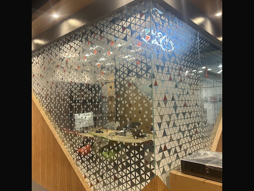 Printed glass panels enclosing a meeting room at the PRO TECHnology office