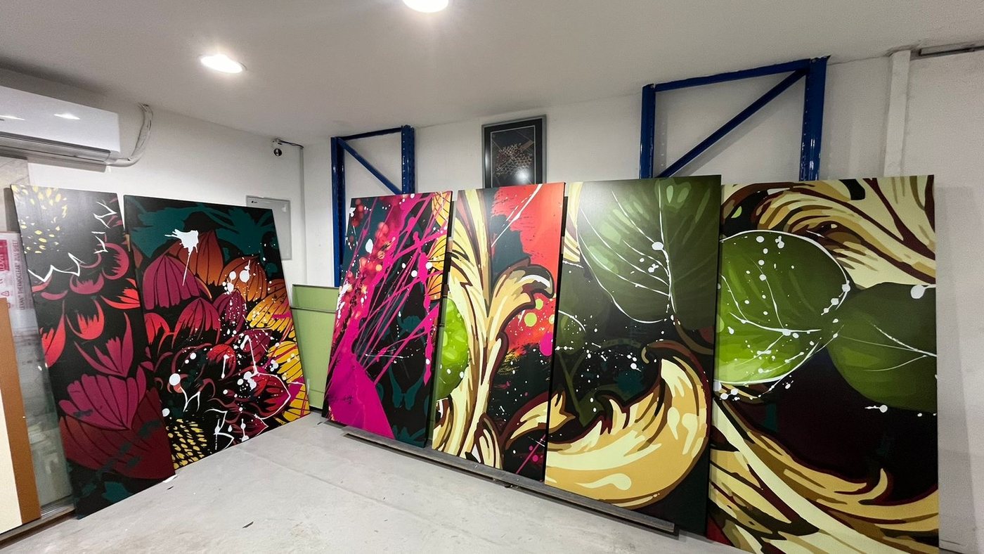 Finished printed panels standing together in the studio before installation