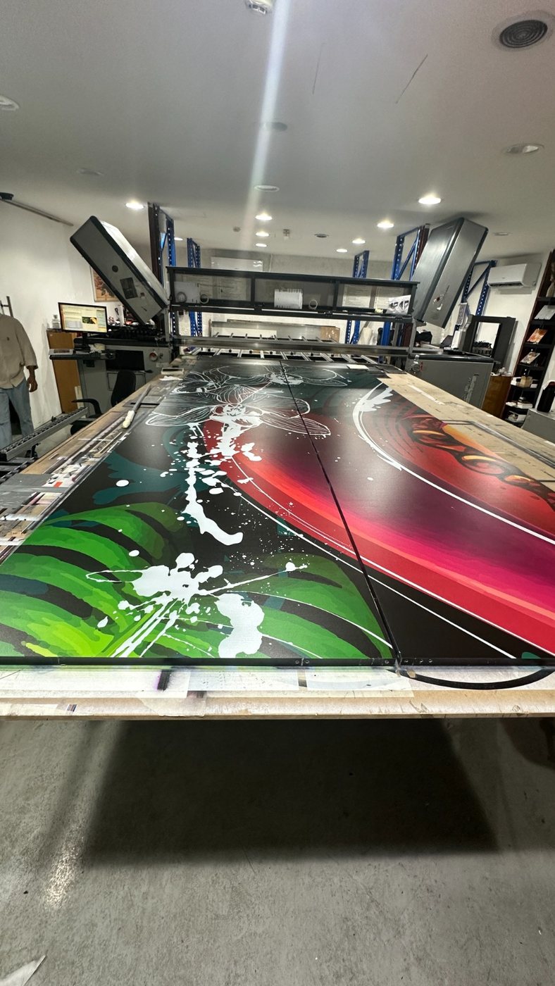 Foliage and colour fields printed across adjoining panels on the press bed