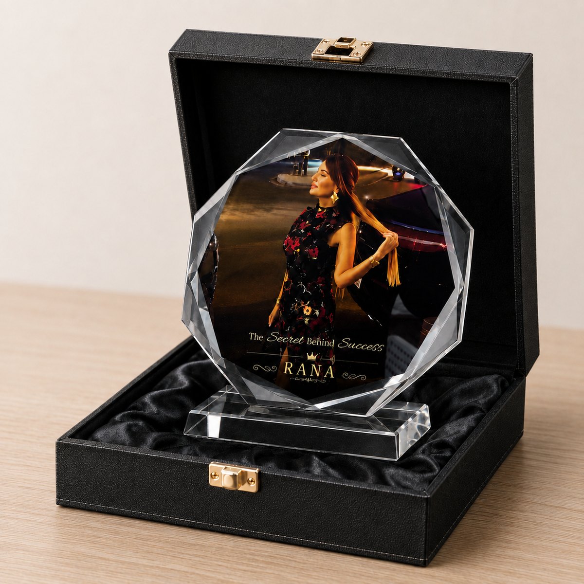 An octagonal crystal award printed in full colour with a photograph and gold lettering, presented in a black gift box