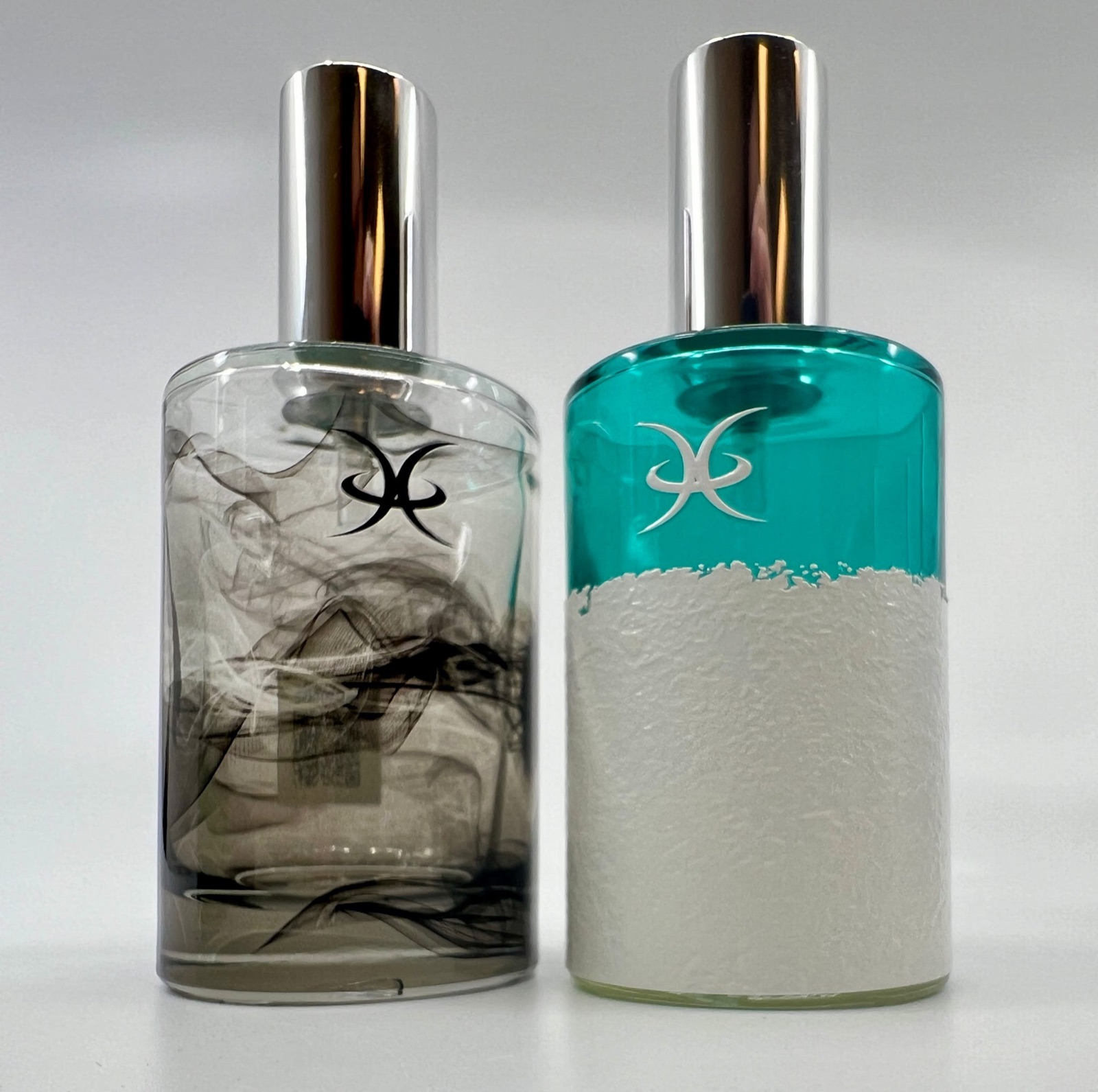 Two printed bottles, one with a photographic wrap and one with a raised textured white finish