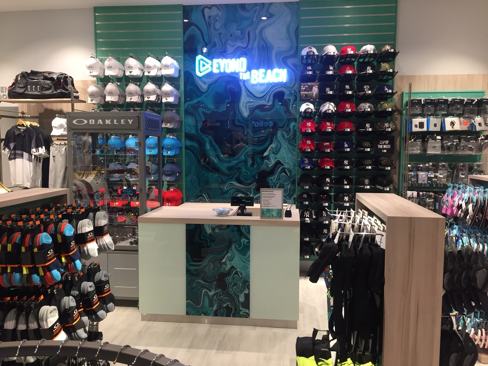 A full-height printed glass feature panel in a retail interior