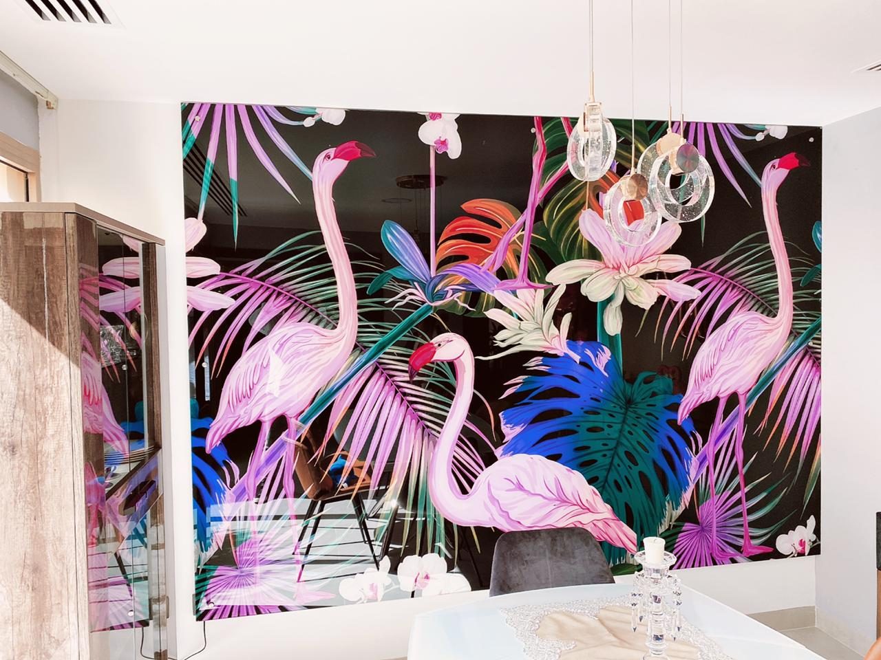 A large printed acrylic feature wall with tropical flamingo artwork installed in a Dubai dining room