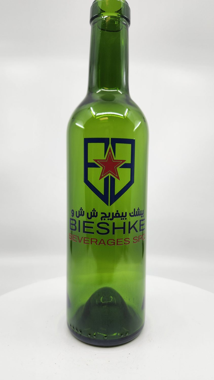 A printed glass beverage bottle sample produced at Sun Studio Dubai