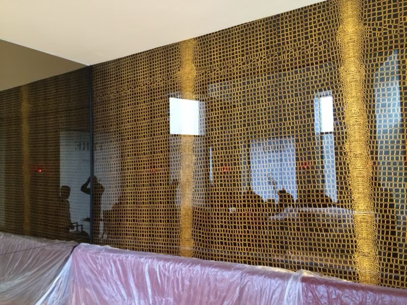 Printed glass counter backsplash in the Caffe Ferre café interior