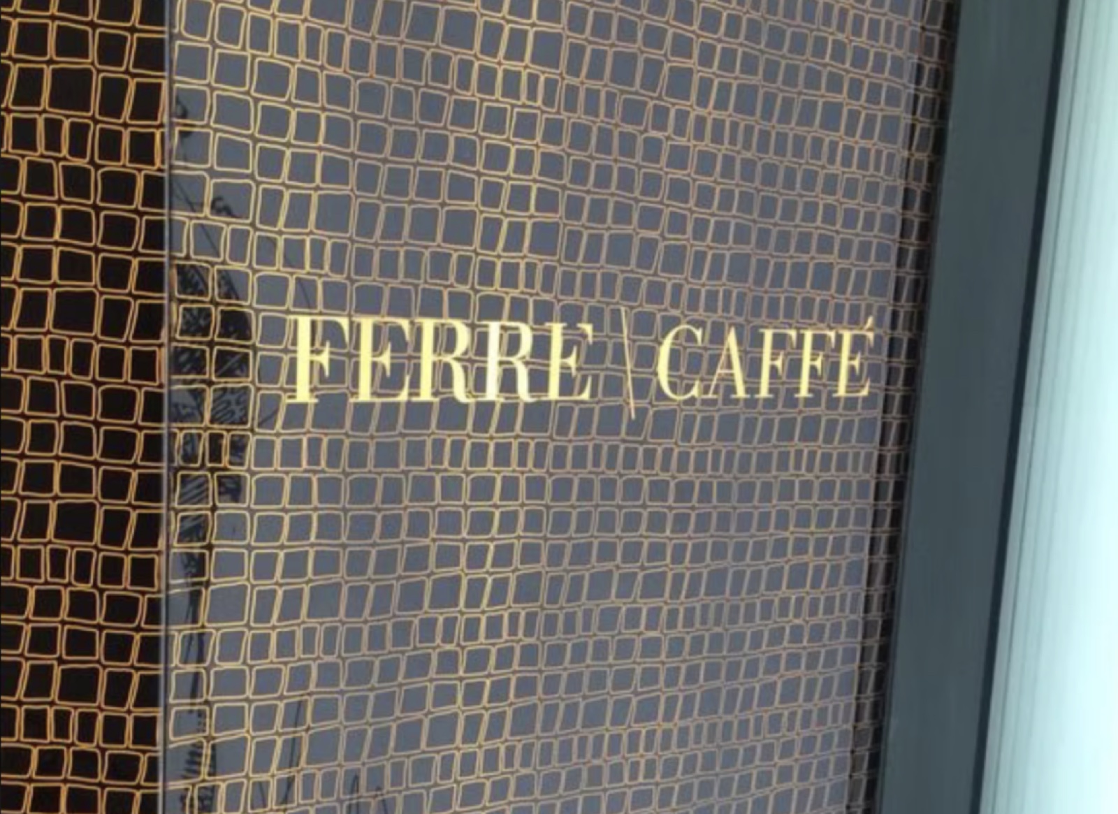 Printed glass menu display in the Caffe Ferre interior