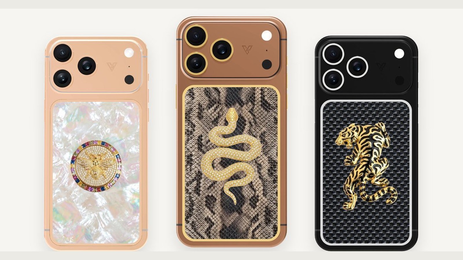 Three customised iPhones side by side: a rose gold frame with a mother-of-pearl back and a round medallion, a bronze-toned frame with snake-textured leather and a gold serpent emblem, and a black frame with carbon fibre and a gold tiger emblem